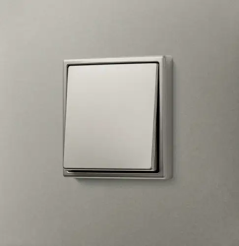 Taster im Programm LS 990 aus Edelstahl, aufgenommen in leichter Perspektive.