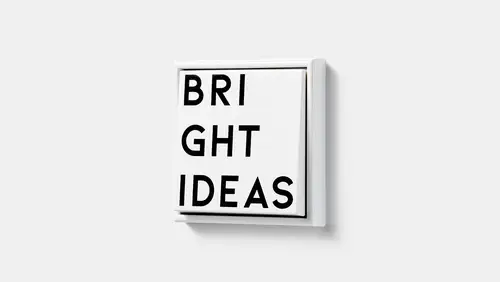 Drukknop in de LS 990-serie in wit met zwarte letters "Bright Ideas", JUNG Unique x Studio Komo.