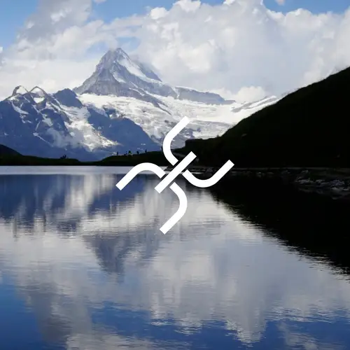 JVP-Remote remote access logo in front of a mountain lake with water reflection.