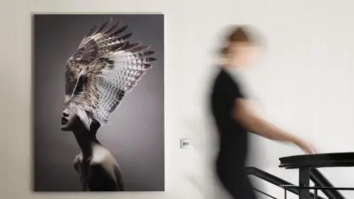 JUNG HOME motion detector. Ambience motif with a person in motion in the stairwell and a motion detector on the wall in the background.