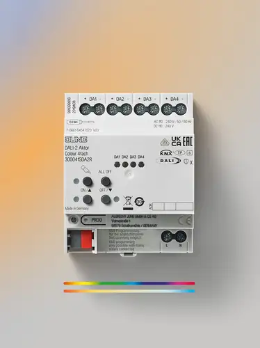DALI-2 actuator in frontal view on a background with a slight colour gradient.