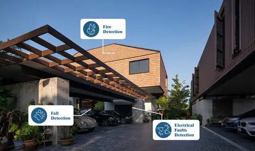 Exterior view of a detached house with carports and the icons for fire, lintel and electrical fault detection