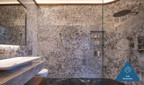 Photo of a bathroom with grey mosaic tiles and lintel recognition symbol.