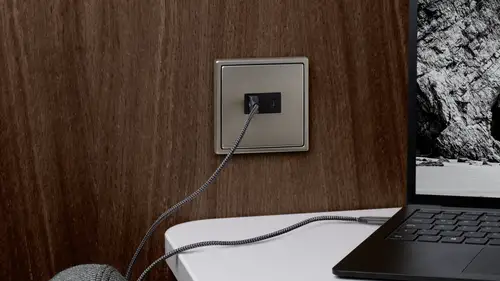 USB charging station in the LS 990 stainless steel switch range.