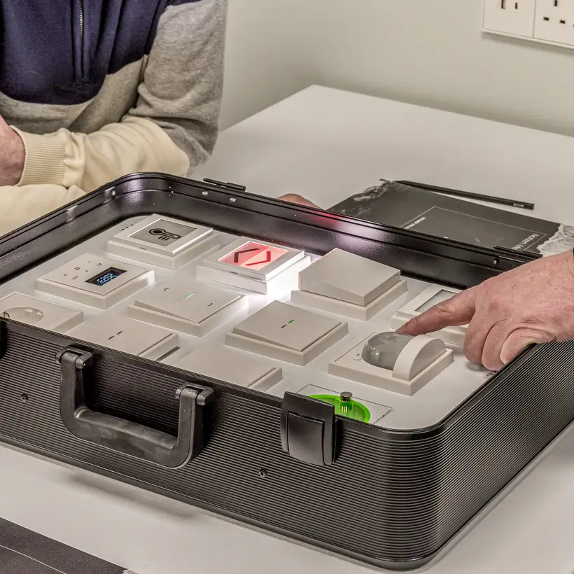 Trainees receive instruction on the various JUNG products, close-up from the new training centre in London. The detail focusses on the product case.
