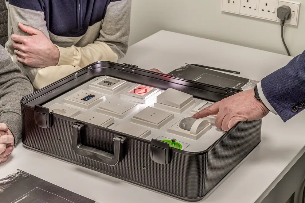 Trainees receive instruction on the various JUNG products, close-up from the new training centre in London. The detail focusses on the product case.