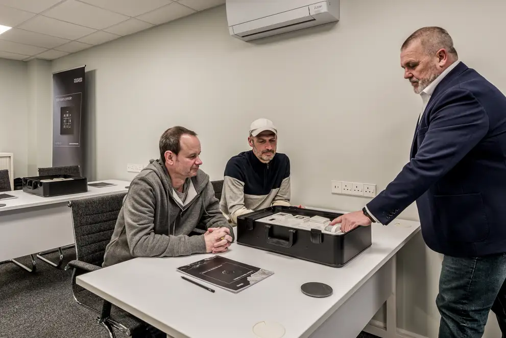 Trainees receive instruction on the various JUNG products, recorded in the London training centre.