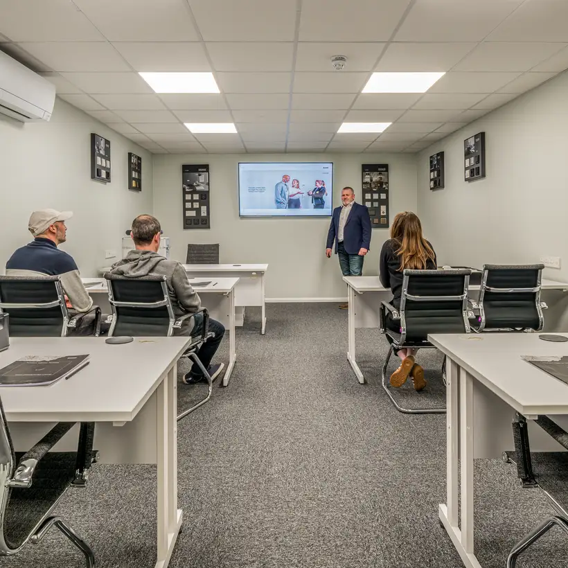 Trainees receive instruction in the training room at the JUNG training centre in London, to become a registered JUNG HOME Installer.