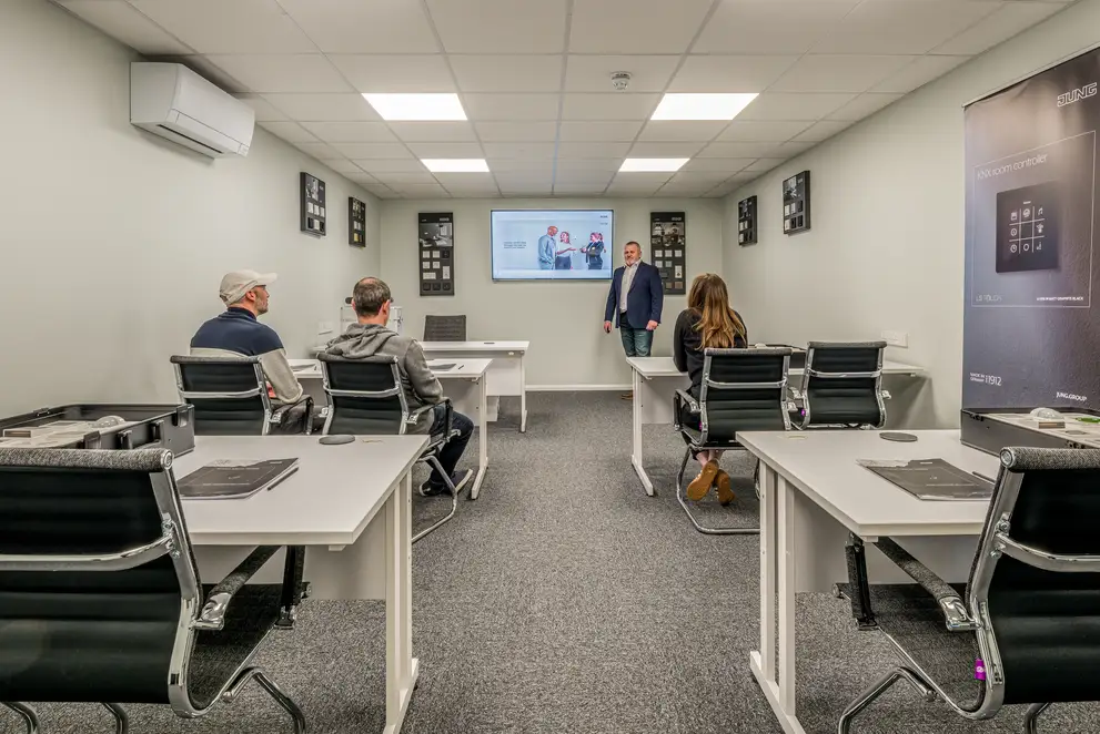 Trainees receive instruction in the training room at the JUNG training centre in London, to become a registered JUNG HOME Installer.