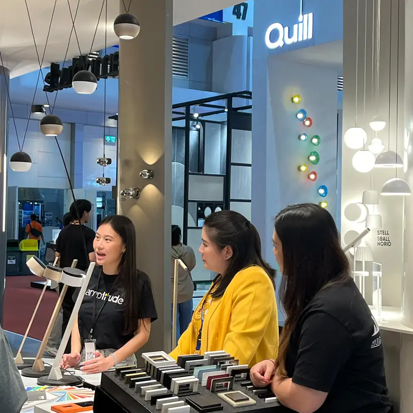 Two ladies receive a briefing on the various JUNG products at the Archtect Expo trade stand.