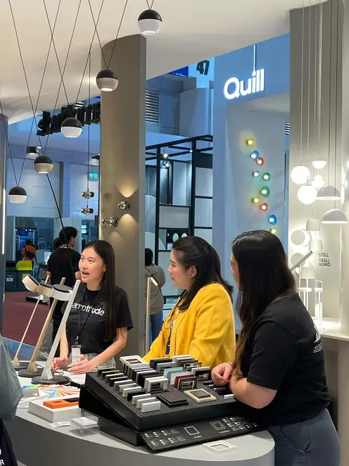 Two ladies receive a briefing on the various JUNG products at the Archtect Expo trade stand.