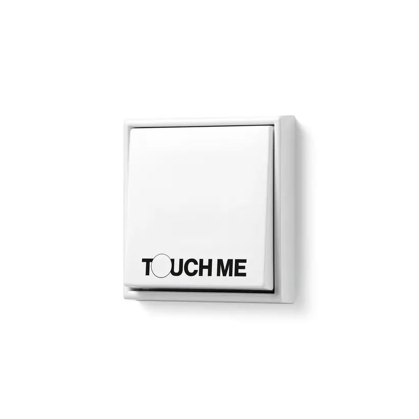 JUNG Unique & IFG LS 990 Schalter in Alpinweiß mit der Aufschrift "Touch me!"