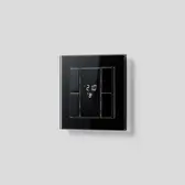 KNX room controller in the range A CREATION with glass frame in black